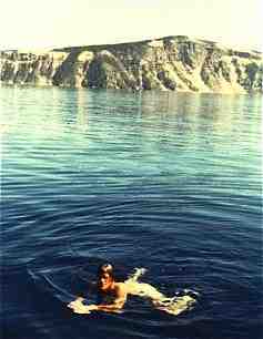 Dave at work in Crater Lake, June 1980. Testing the water's temperature. (11KB/102KB)